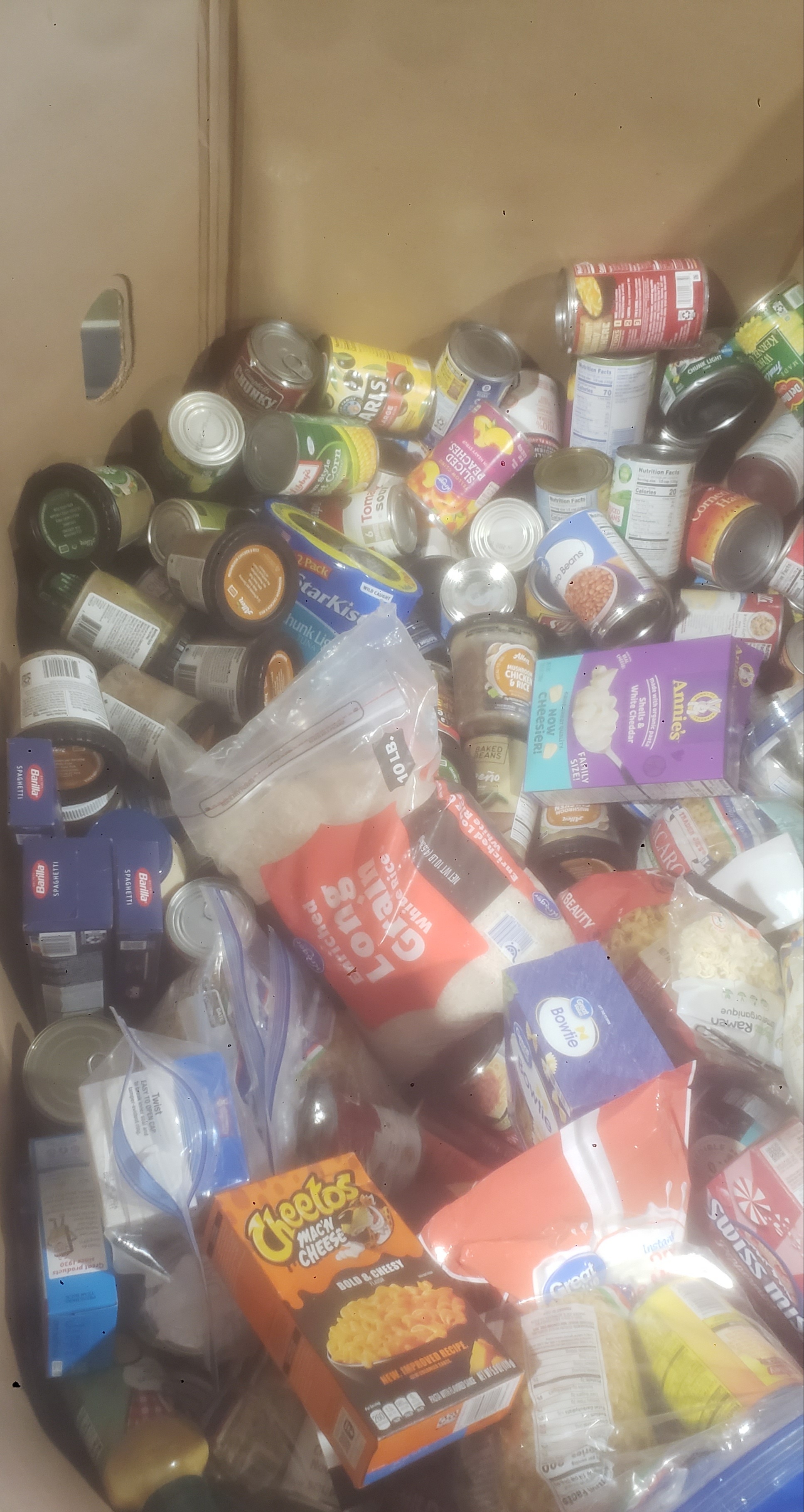 Cardboard container full of different foods.